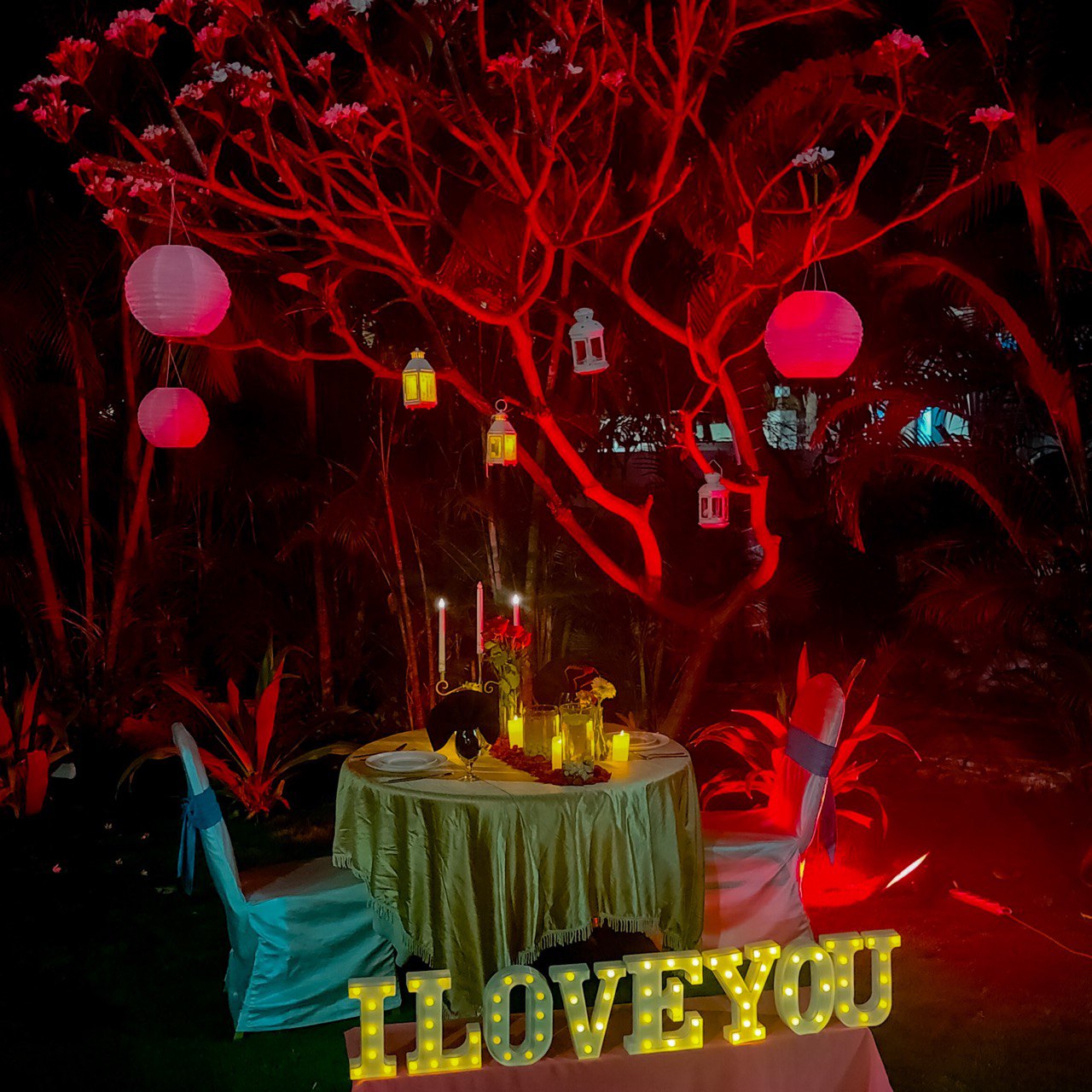 Celebrate love with a private candle light dinner in Hyderabad, complete with 'I LOVE YOU' LED decorations.