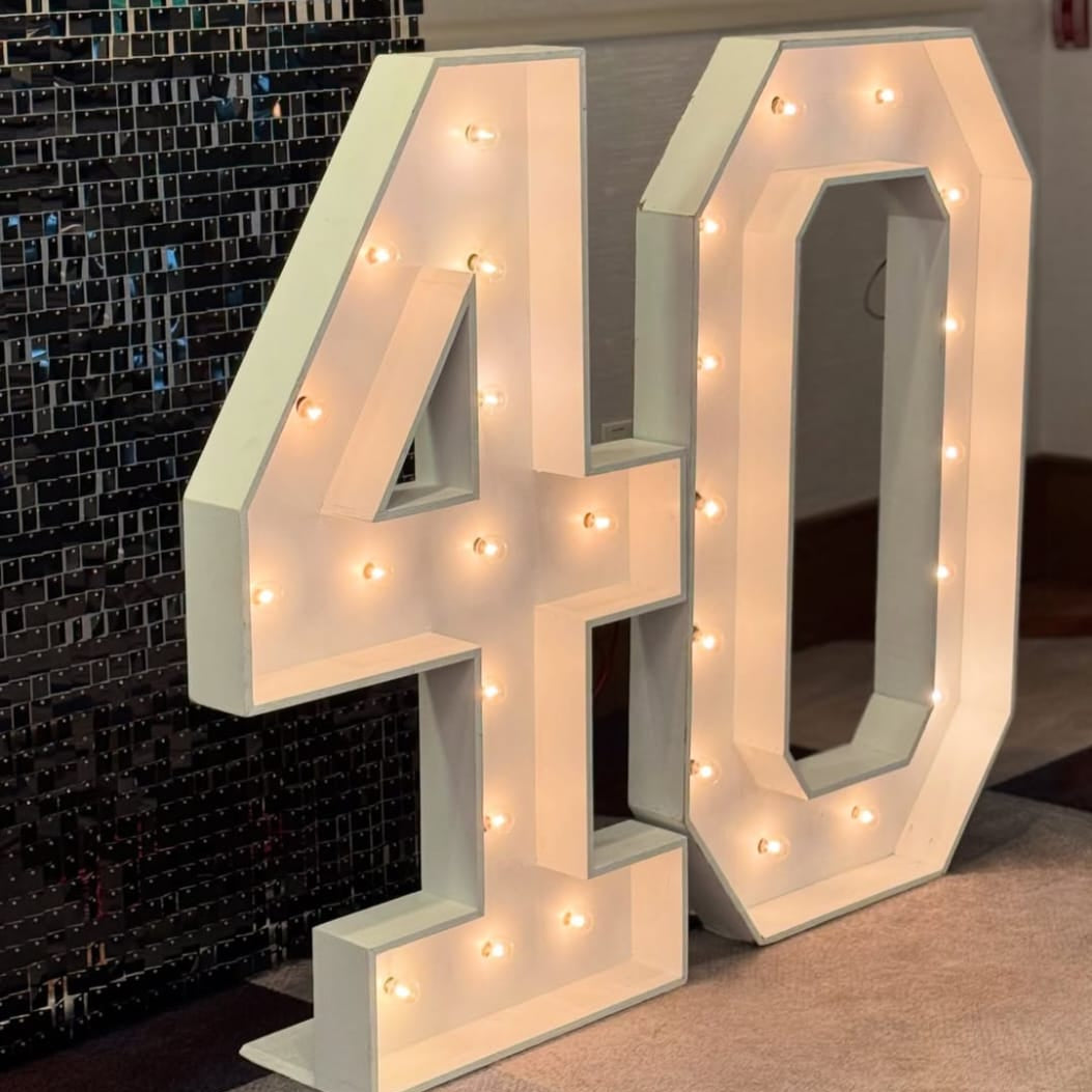 Luxury black and gold birthday decoration with column and illuminated LED numbers 40 in Hyderabad