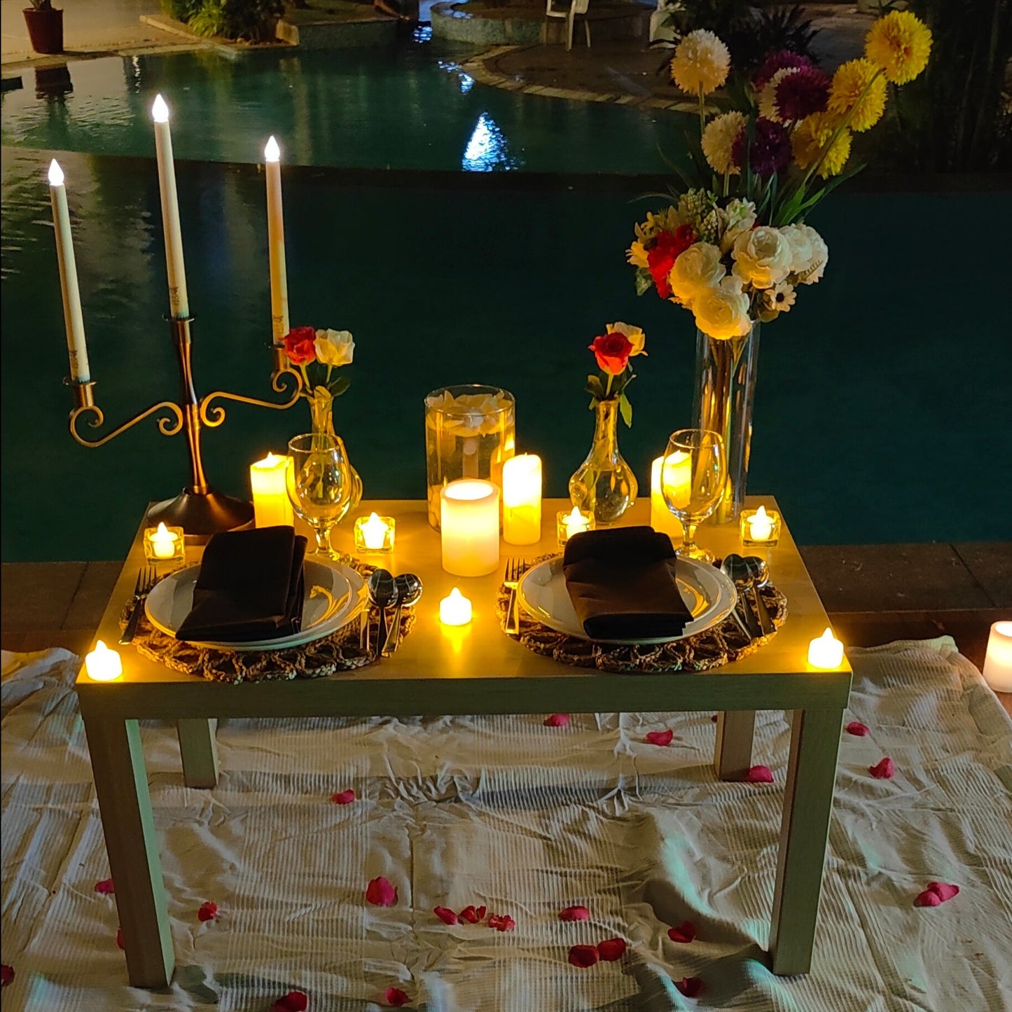 Birthday celebration in Hyderabad with a luxurious poolside candle light dinner, complete with a personal butler and 5-course meal.