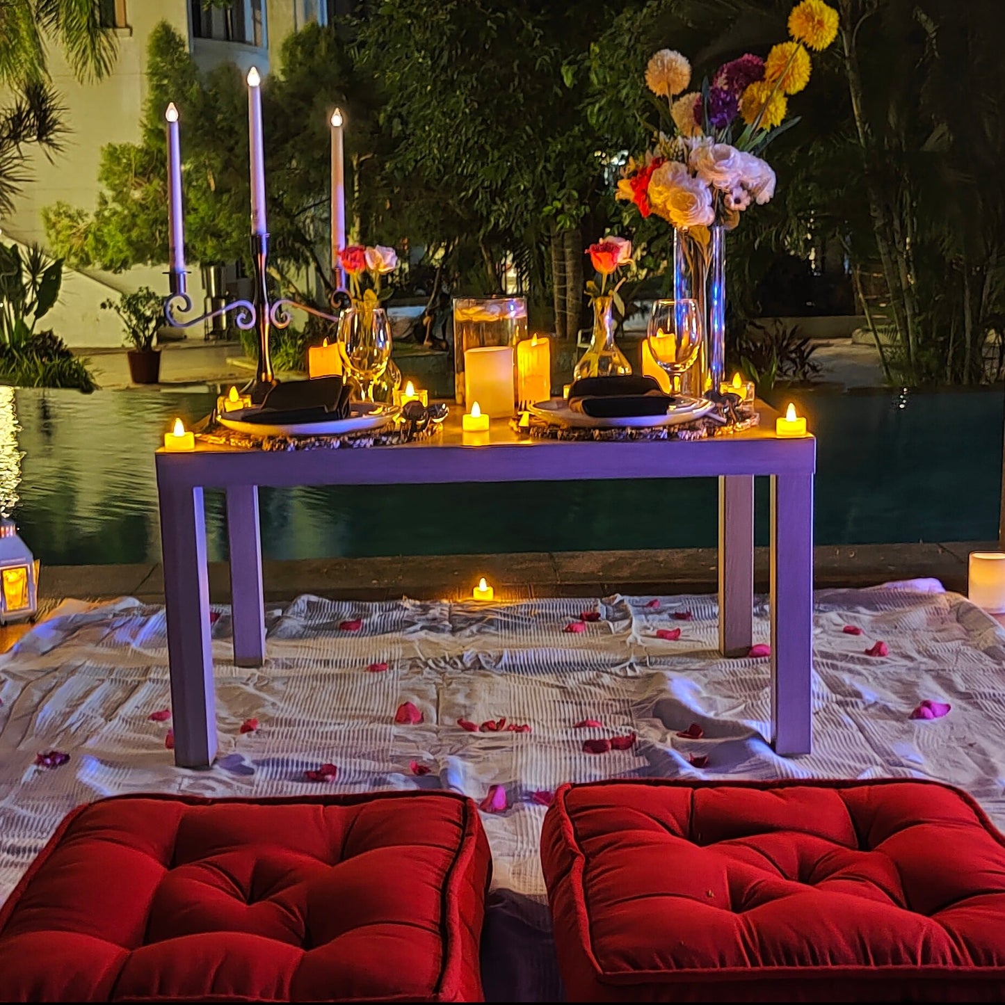 Luxurious low-seating private poolside candle light dinner in Hyderabad at The Manohar, perfect for romantic celebrations.