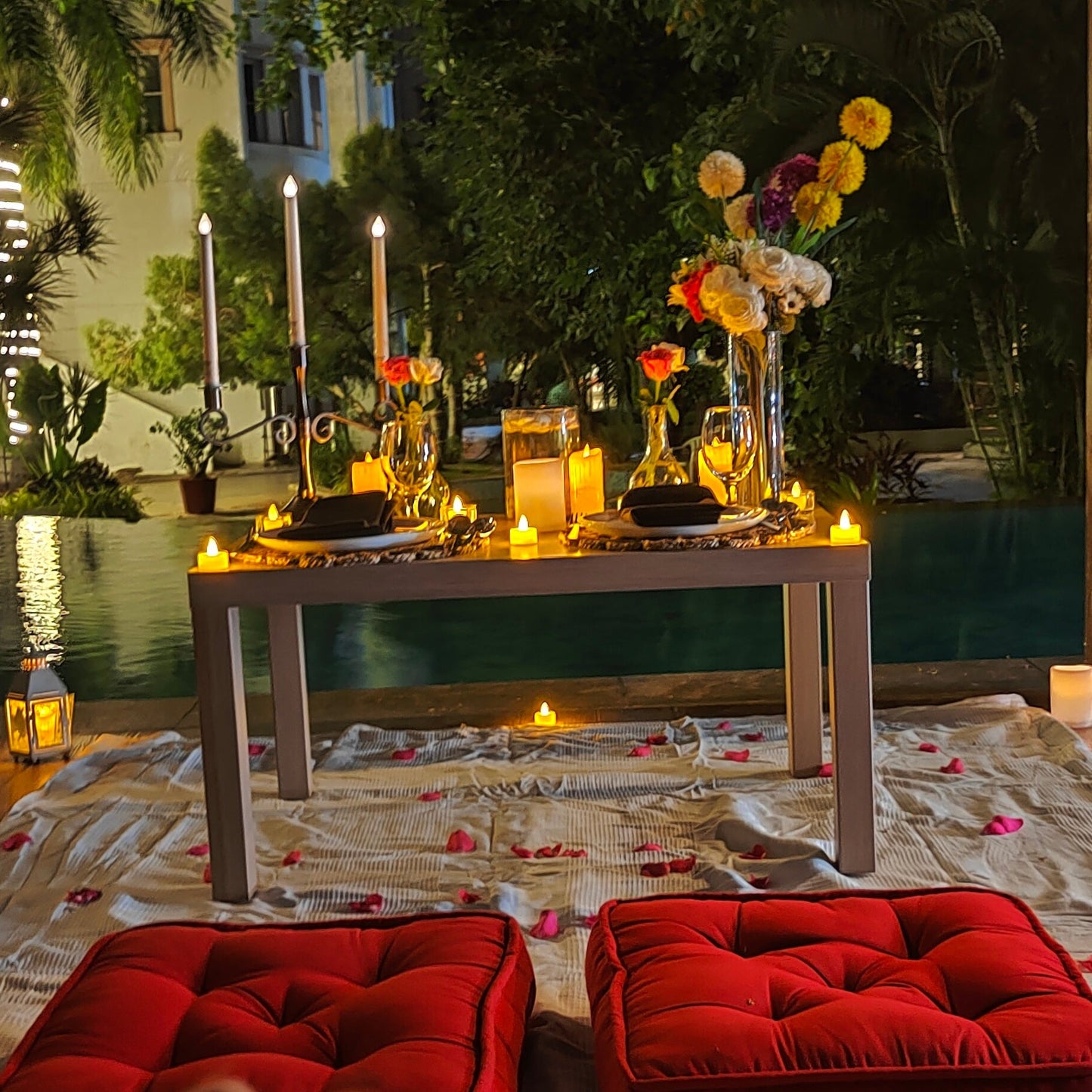 Romantic candle light dinner in Hyderabad with low-seating arrangements, ideal for anniversaries and birthdays.