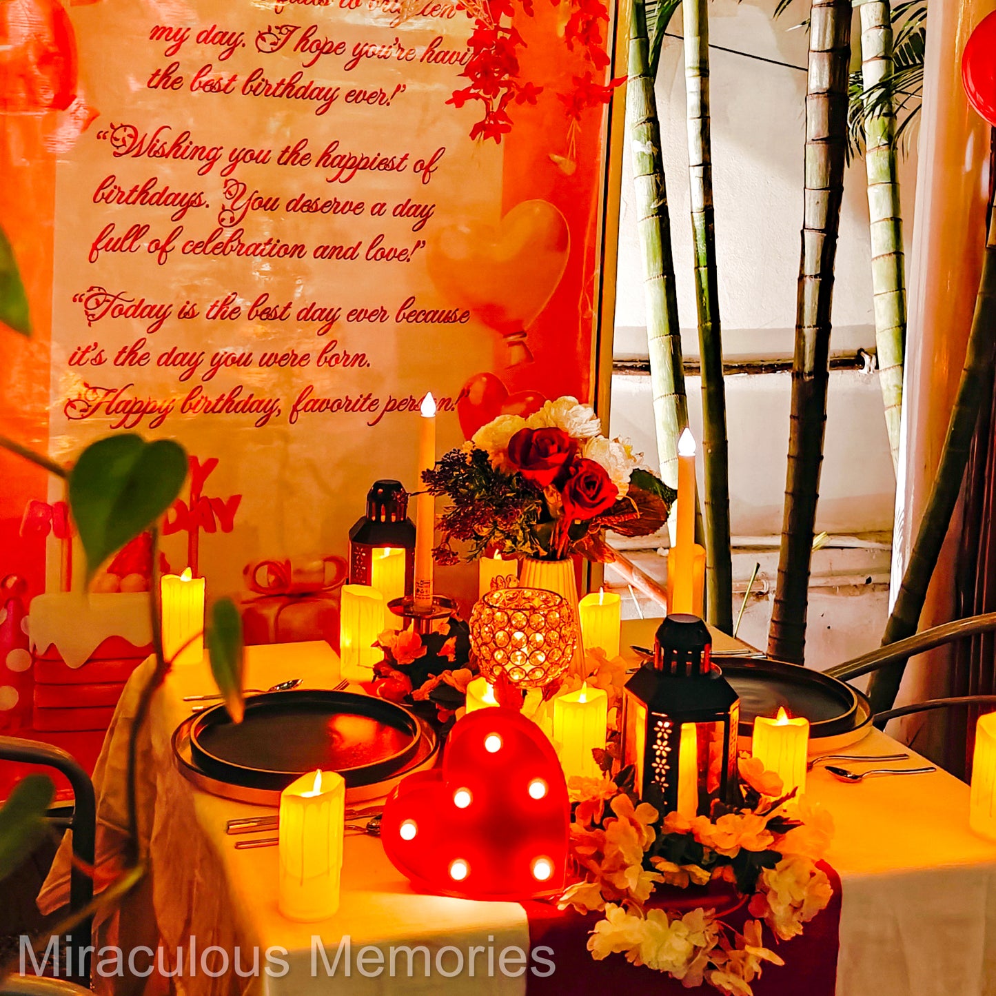 "Personalized romantic candle light dinner setup with flex display and paper banner at Bel Posto Cafe, Hyderabad."