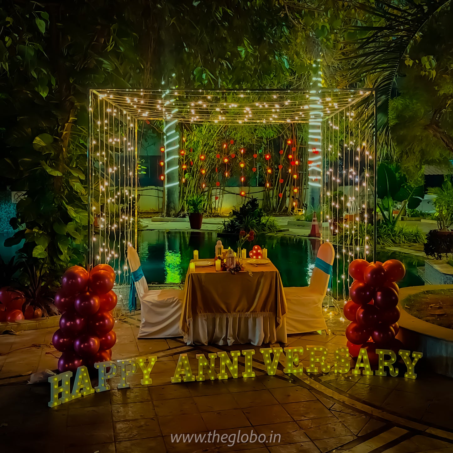 Luxurious anniversary celebration in Hyderabad with a poolside candle light dinner offering stunning city views.