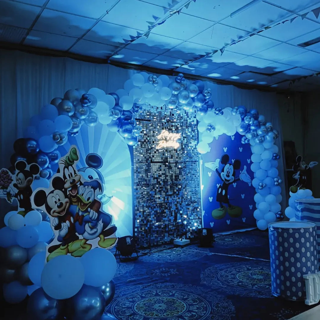 Mickey Mouse blue theme birthday decoration in Hyderabad with balloon cloud displays, Disney character cutouts, and shimmer wall backdrop.