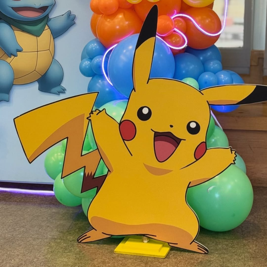 Pikachu birthday balloon decoration Hyderabad with rainbow balloons and Squirtle backdrop