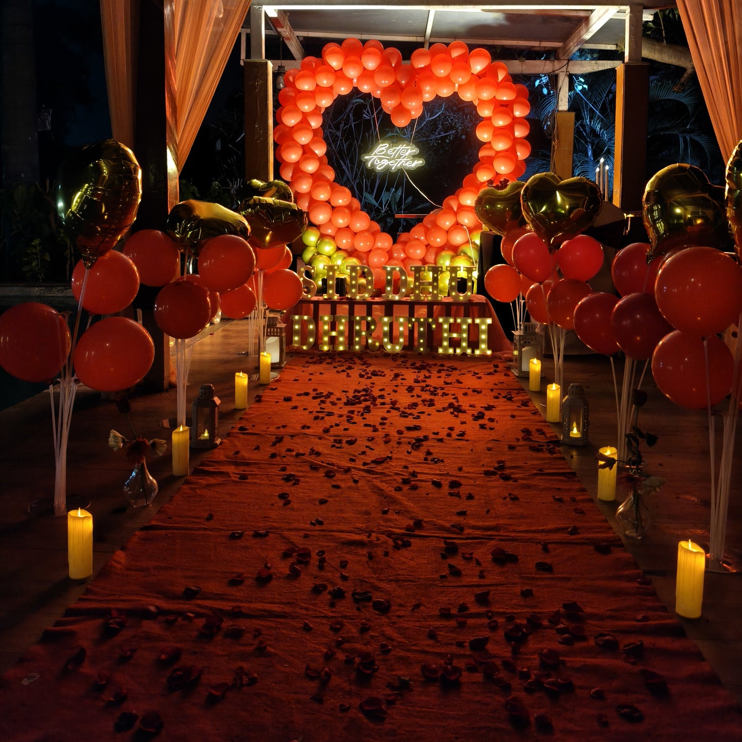Red Heart background proposal set up in Hyderabad at poolside with Candle Light dinner