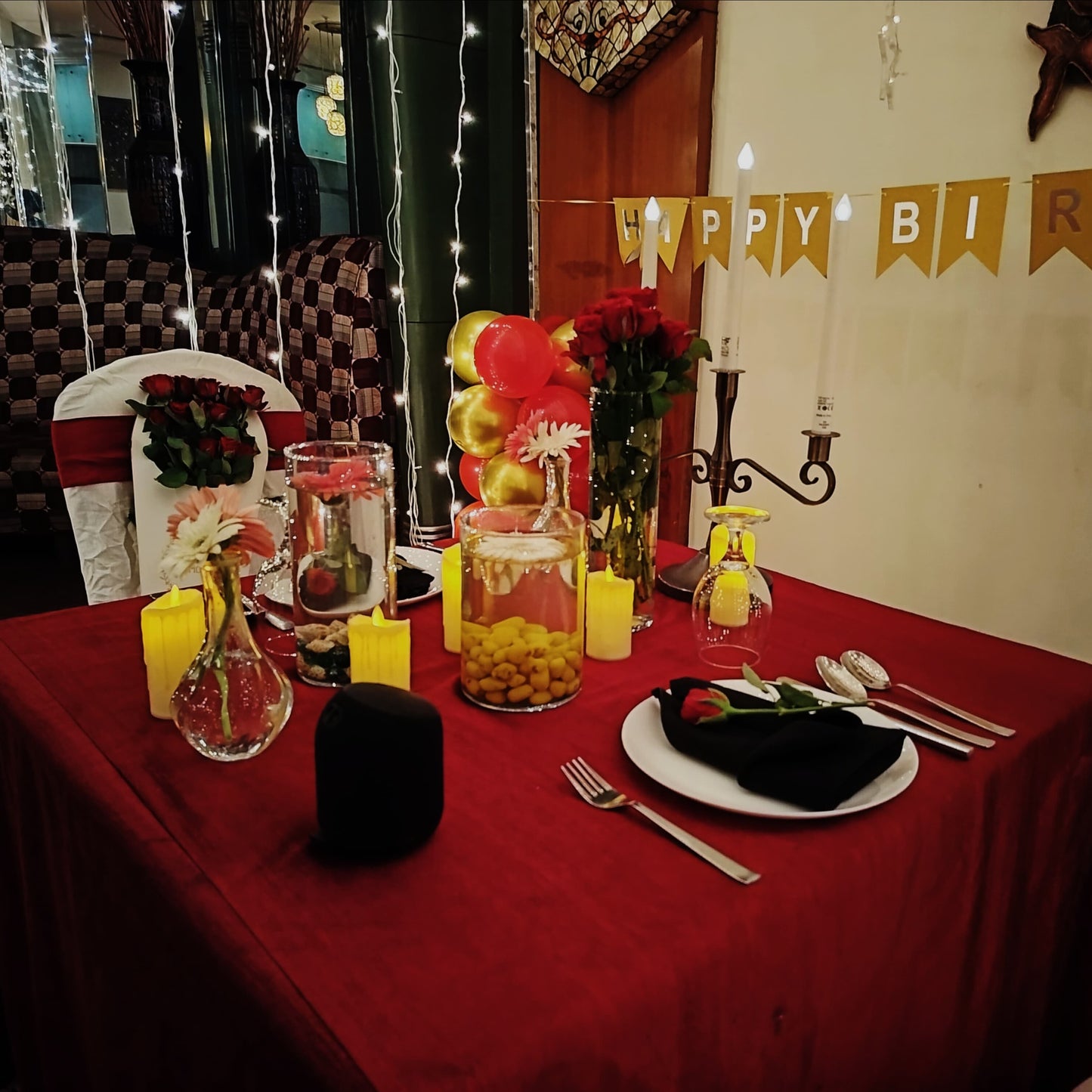 Celebrate your birthday in Hyderabad with a private hall candle light dinner featuring a red carpet and exotic decor.