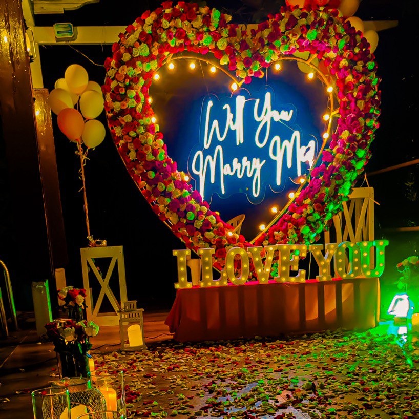 Anniversary celebration in Hyderabad at The Manohar with a personalized 5-course meal, cake, and romantic decorations.
