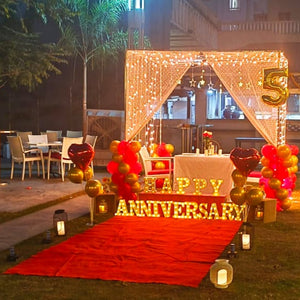 Elegant open garden candle light dinner setup in Hyderabad, ideal for romantic celebrations and proposals.