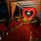 Proposal Decoration with candle light dinner at poolside. Decoration with red and gold heart-shaped balloon decoration at The Manohar Begumpet in Hyderabad