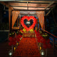 Romantic proposal decoration in red and gold theme at poolside with Candle light Dinner 