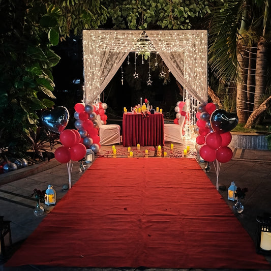 Romantic poolside cabana candle light dinner in Hyderabad with mirchi lights and elegant table decorations.