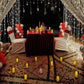 Luxurious anniversary celebration in Hyderabad featuring a poolside candle light dinner with a red carpet entrance.