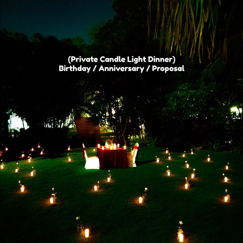 "Luxurious birthday celebration in Hyderabad with a beautifully decorated candle light dinner arrangement."