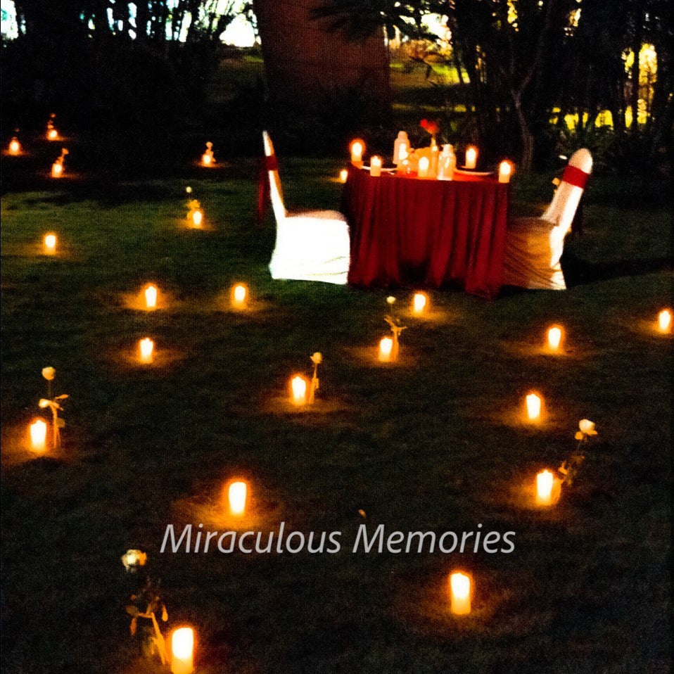 "Beautifully crafted proposal setup in Hyderabad with a grand open-air candle light dinner arrangement."